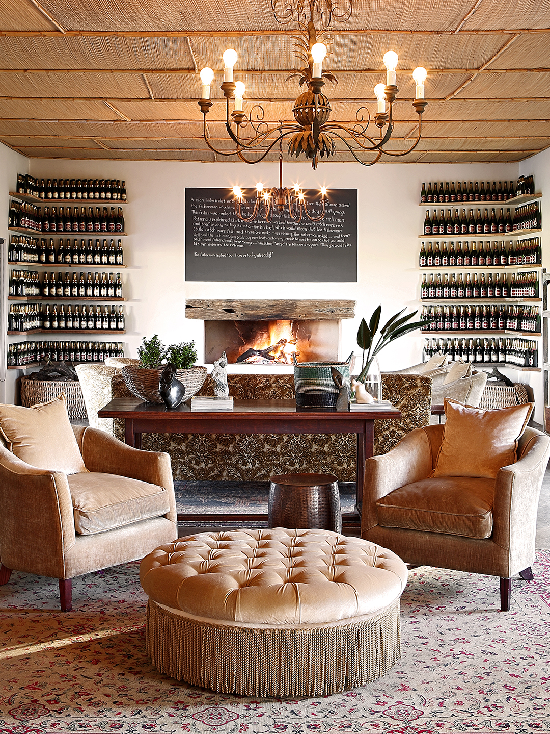 Interior of The Wine Bar with luxurious armchairs and a roaring fire.